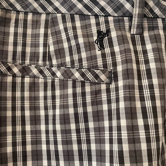 Ashworth Men’s Golf Shorts. Waist size is 35”. Black background with a pattern. - Picture 3 of 6